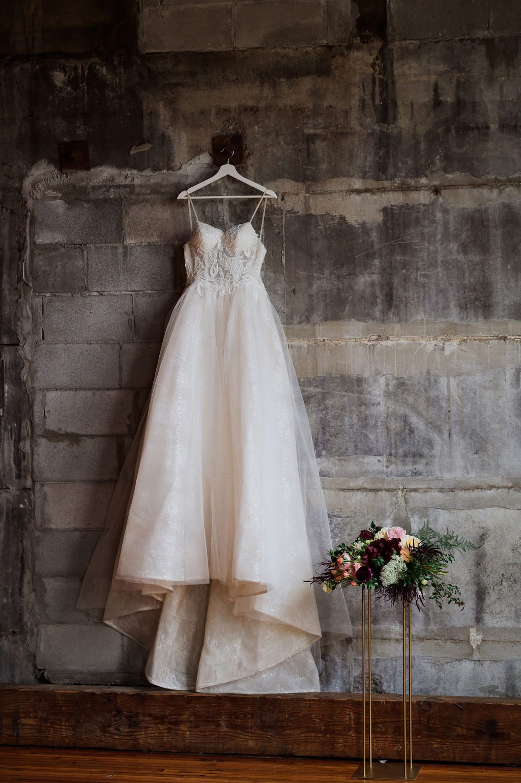 industrial wedding at Olio hanging dress shot