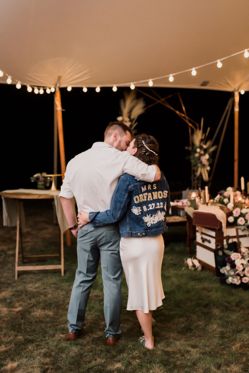 backyard summer wedding kissing at reception