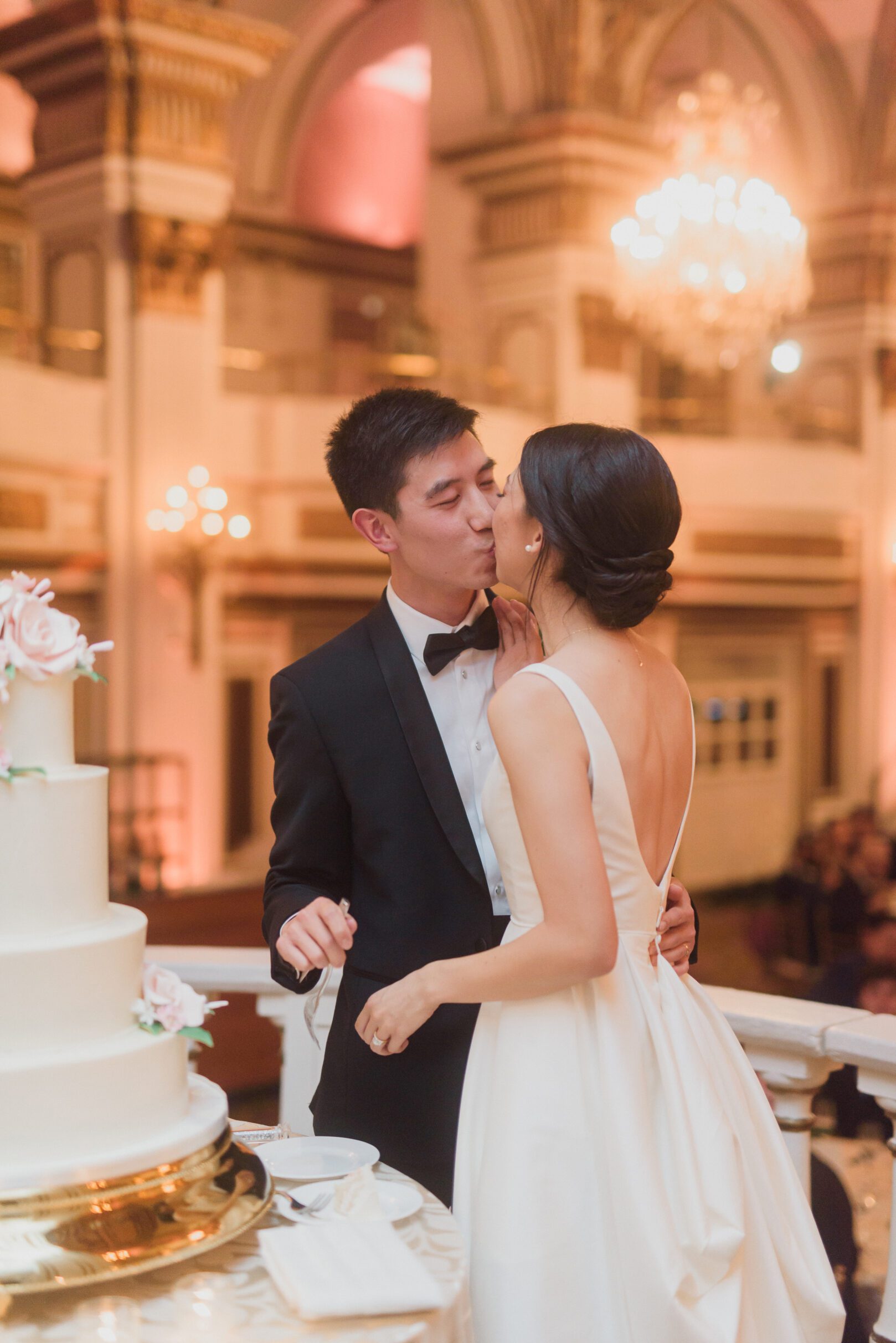 boston wedding photographers fairmont copley plaza hotel wedding cake cutting