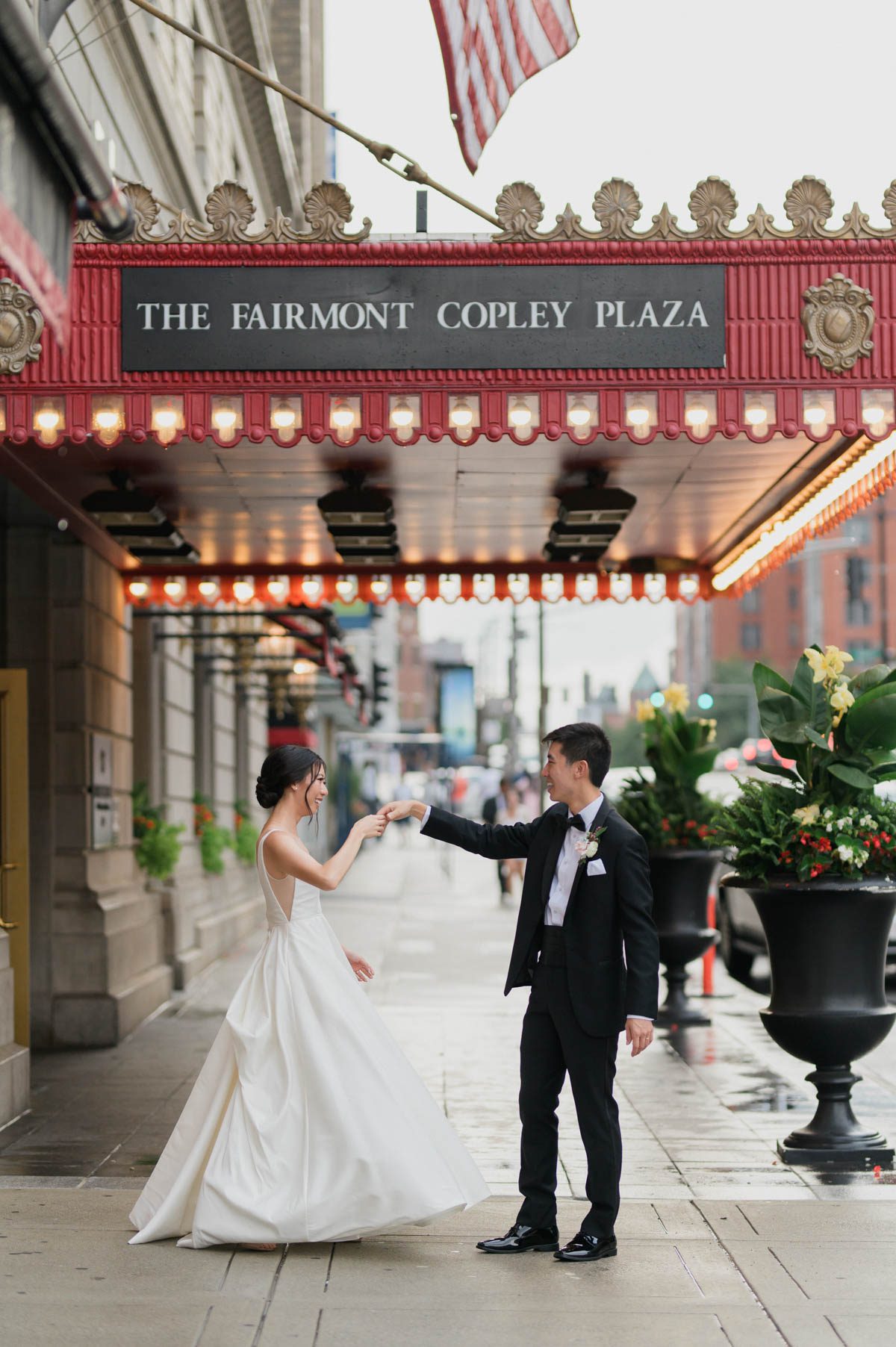 fairmont copley plaza wedding bride and groom dancing in the rain