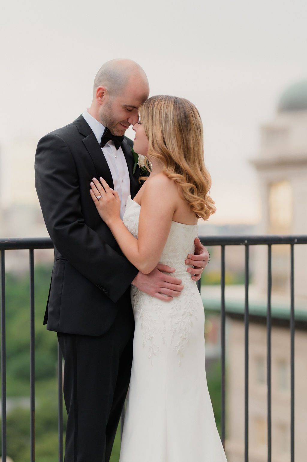 omni parker house rooftop wedding portraits of bride and groom